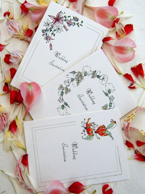 Floral wedding invitations featuring original hand-drawn artwork.